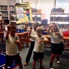 young students pretending to drive cars